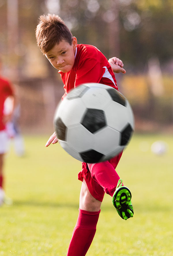kid-kicking-soccer-ball.jpg