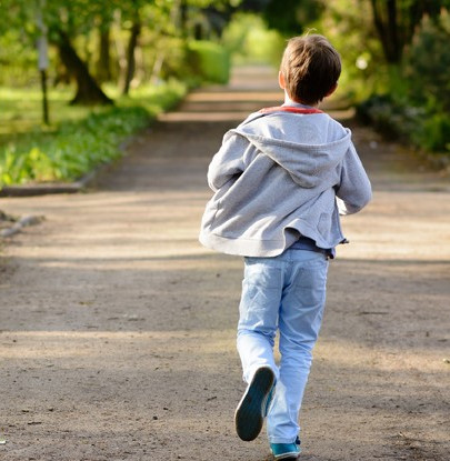 A boy running away