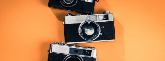 Old Cameras on orange background