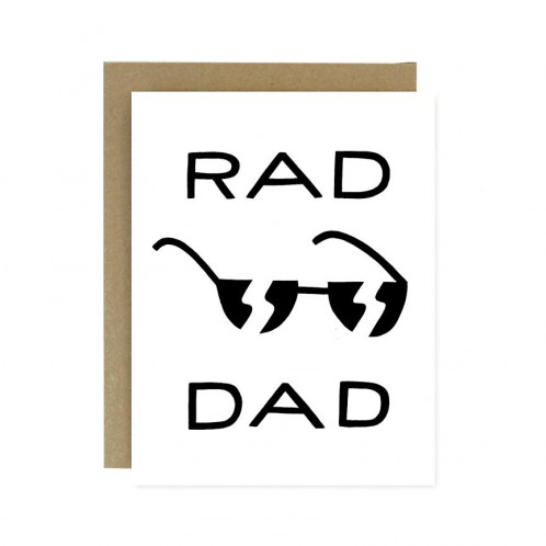 A pair of black and white sunglasses with the word Rad above and the word Dad below