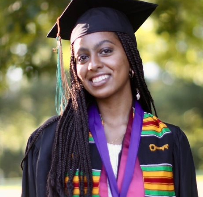 Reweena Debebe wearing a graduation cap and gown