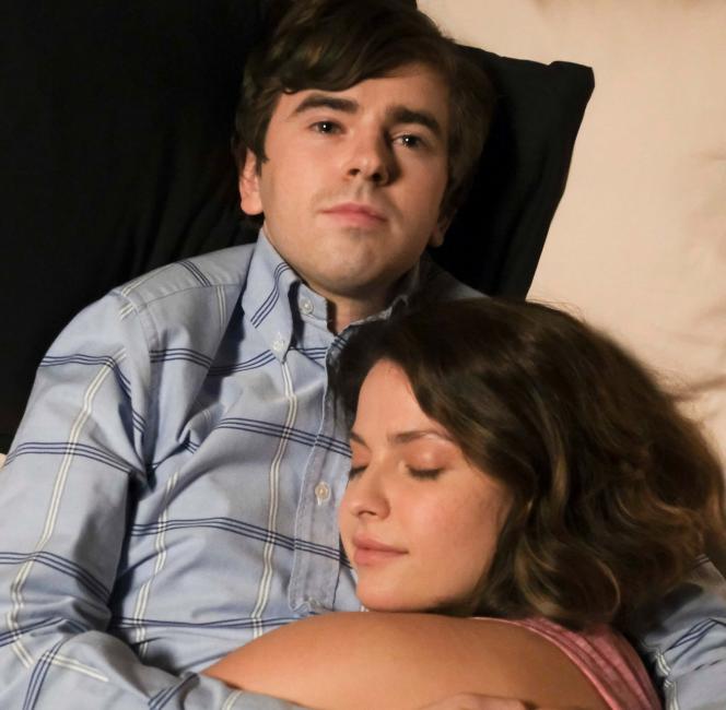 Freddie Highmore as Dr. Shaun Murphy and Paige Spara as Lea Dilallo cuddling on a bed