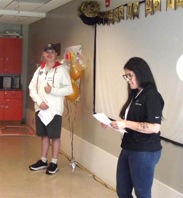 Vanessa Coens talks about the impact that Niagara Region’s Summer Camps have had on their family while her son Owen looks on.