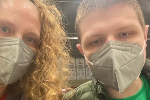 Sefie of Fiona and Makobe wearing masks at the vaccine clinic
