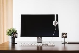 modern desktop setup and white headphones